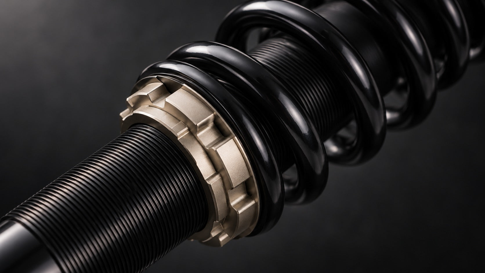 Illustrative close-up of a coilover spring and adjustment collar